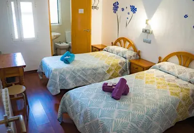 Cama o camas de una habitación en HOSTAL CACHE