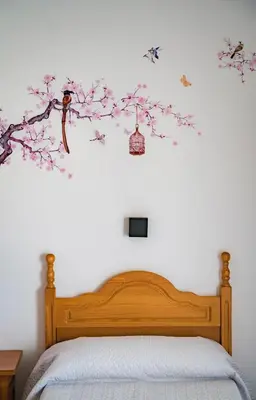 Cama o camas de una habitación en HOSTAL CACHE