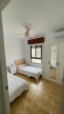 Cama o camas de una habitación en El Paraíso Retamar