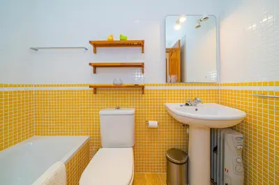 Un baño de Colino