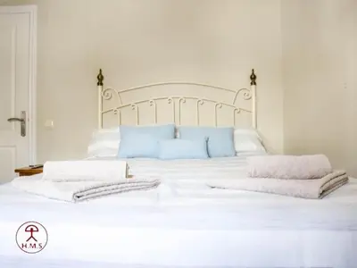 Cama o camas de una habitación en Las Palmeras