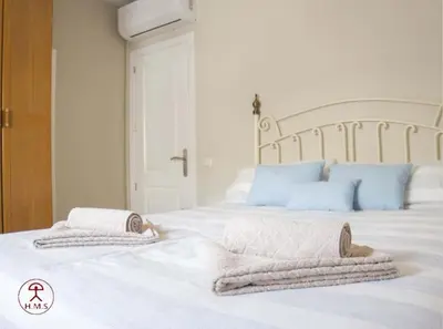 Cama o camas de una habitación en Las Palmeras