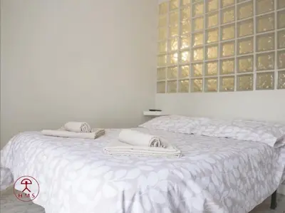 Cama o camas de una habitación en Las Palmeras
