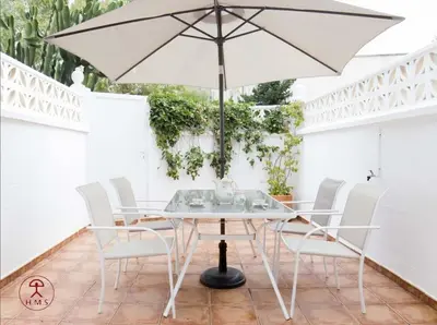 Un patio o zona al aire libre en Las Palmeras