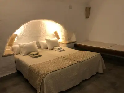Cama o camas de una habitación en Cueva Aventura