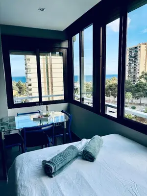 Cama o camas de una habitación en Apartamento en Aguadulce Playa con vistas al mar y piscina