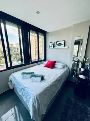 Cama o camas de una habitación en Apartamento en Aguadulce Playa con vistas al mar y piscina