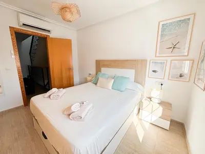 Cama o camas de una habitación en Casa Lodelia-Maison climatisée avec vue mer et montagne