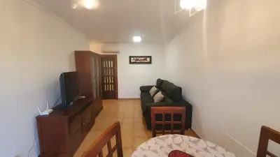 Una televisión o centro de entretenimiento en ALANDALUSTHALASSA.COM Apartamento Planta Baja