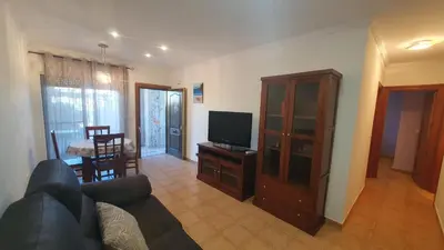 Una televisión o centro de entretenimiento en ALANDALUSTHALASSA.COM Apartamento Planta Baja