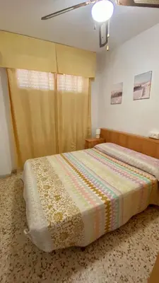 Cama o camas de una habitación en Balcón de Aguilas Espectacular Piso en primera linea de playa