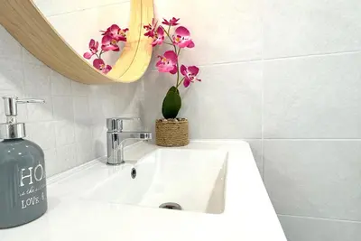 Un baño de Apartamentos Vela Blanca