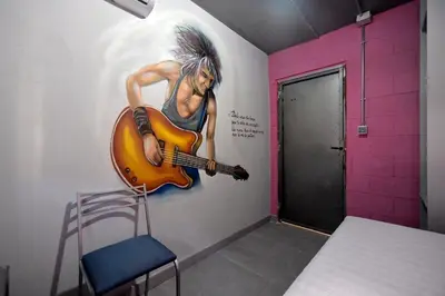 Cama o camas de una habitación en Apartamentos Nirvana y Averno