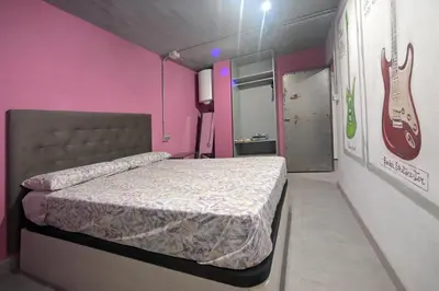 Cama o camas de una habitación en Apartamentos Nirvana y Averno