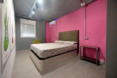 Cama o camas de una habitación en Apartamentos Nirvana y Averno