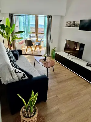 Una televisión o centro de entretenimiento en Apartamento Con Vistas al Mar