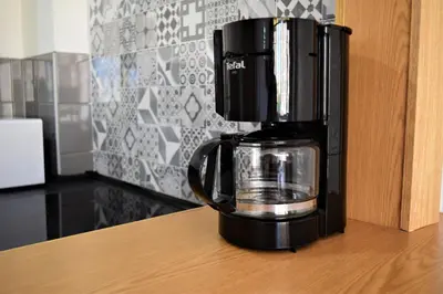 Una cocina o zona de cocina en Luminoso apartamento que tiene amplia terraza, gran piscina y a 4 min de la playa