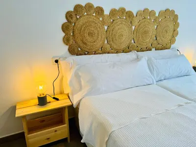 Cama o camas de una habitación en AquaHome- Precioso apartamento con piscina, 3 minutos a pie de Vera Playa