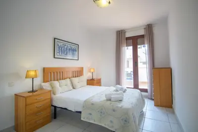 Cama o camas de una habitación en Mediterranea 5 Vera Playa Jardines tus momentos frente al mar