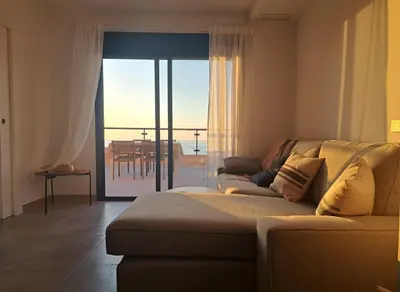Zona de estar de roomwithview casa marco