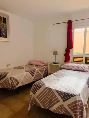 Cama o camas de una habitación en Apartamento El Palmeral 1ª línea