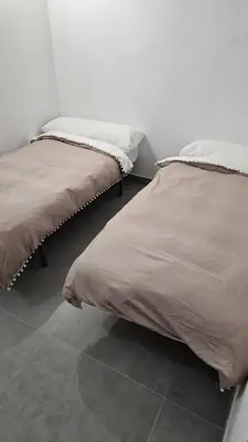 Cama o camas de una habitación en Cuevas CEMAR