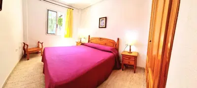 Cama o camas de una habitación en Bajo VERAMAR 1 frente a parque 2 dormitorios 500 metros de la playa