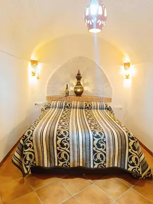 Cama o camas de una habitación en Casa Cueva The Exclusive Royal Andalusian Cave