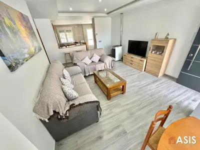 Una televisión o centro de entretenimiento en Apartamento asis B