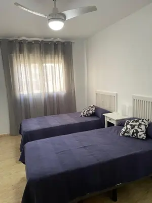 Cama o camas de una habitación en Piso con plaza garaje
