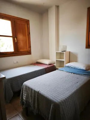 Cama o camas de una habitación en El mirador del beregenal