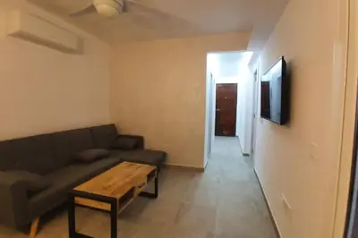 Una televisión o centro de entretenimiento en SweetWater Beach - Apartamento turístico en zona puerto