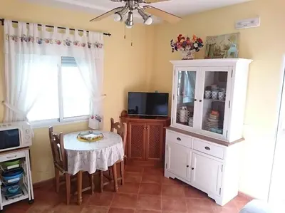 Una televisión o centro de entretenimiento en Casa La Calilla