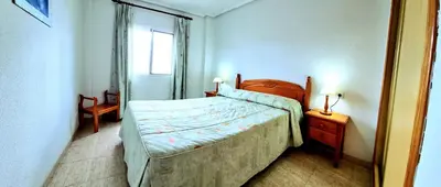 Cama o camas de una habitación en Apartamento dos dormitorios Veramar 5 1ª línea de playa con vistas al mar