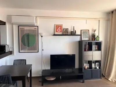 Una televisión o centro de entretenimiento en Apartamento con vistas