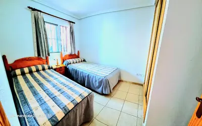 Cama o camas de una habitación en Ático con solarium Veramar 4 dos dormitorios en 1ª línea de playa