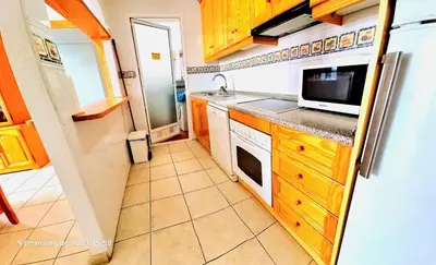 Una cocina o zona de cocina en Ático con solarium Veramar 4 dos dormitorios en 1ª línea de playa