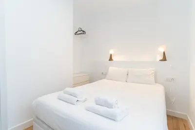 Cama o camas de una habitación en Casa en primera línea de playa, en paseo marítimo