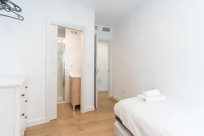 Cama o camas de una habitación en Casa en primera línea de playa, en paseo marítimo