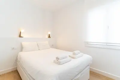 Cama o camas de una habitación en Casa en primera línea de playa, en paseo marítimo