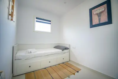 Cama o camas de una habitación en Natura Mediterranea 2 dormitorios naturista junto al mar