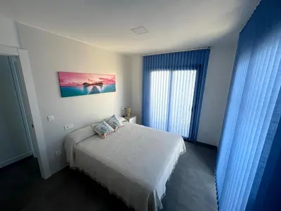 Cama o camas de una habitación en Apartamento en Vera Playa con piscina junto al Mar