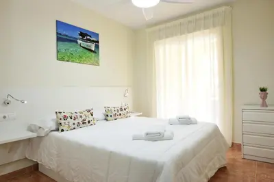 Cama o camas de una habitación en Vera Playa Bajo 2 Terrazas Jardín Piscina Parking