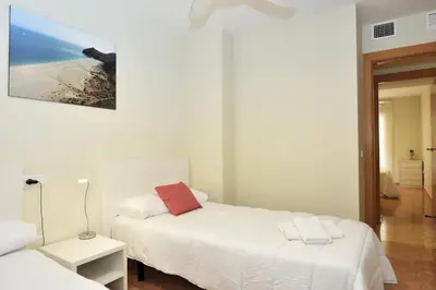Cama o camas de una habitación en Vera Playa Bajo 2 Terrazas Jardín Piscina Parking