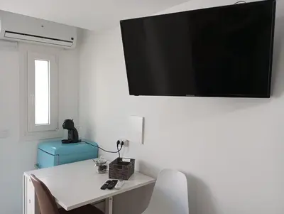Una televisión o centro de entretenimiento en Gaviotas Beach Golf Love 11