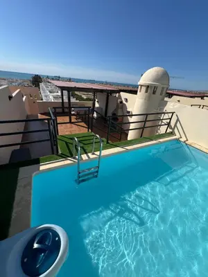 Piscina en o cerca de Ático con vistas al mar y piscina privada