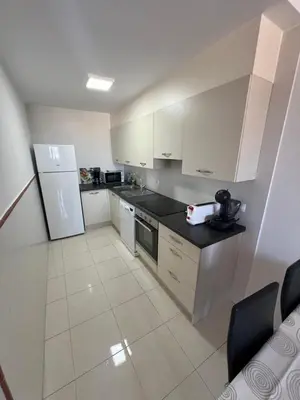 Una cocina o zona de cocina en Ático con vistas al mar y piscina privada