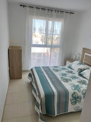 Cama o camas de una habitación en Ático con vistas al mar y piscina privada