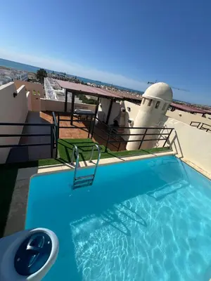 Piscina en o cerca de Ático con vistas al mar y piscina privada