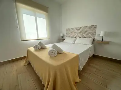 Cama o camas de una habitación en Vive Vera Rentals - Apto 1 Hab Vera Colina